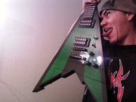 Anthony Gamex licking his Fireplant Guitars WMD-V.